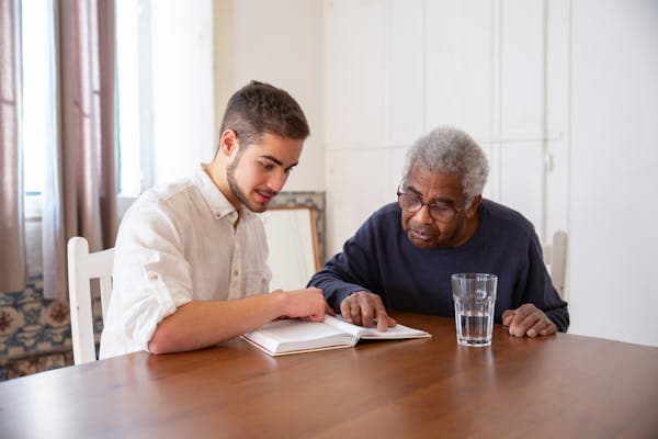 Family member caring for elderly loved one at home