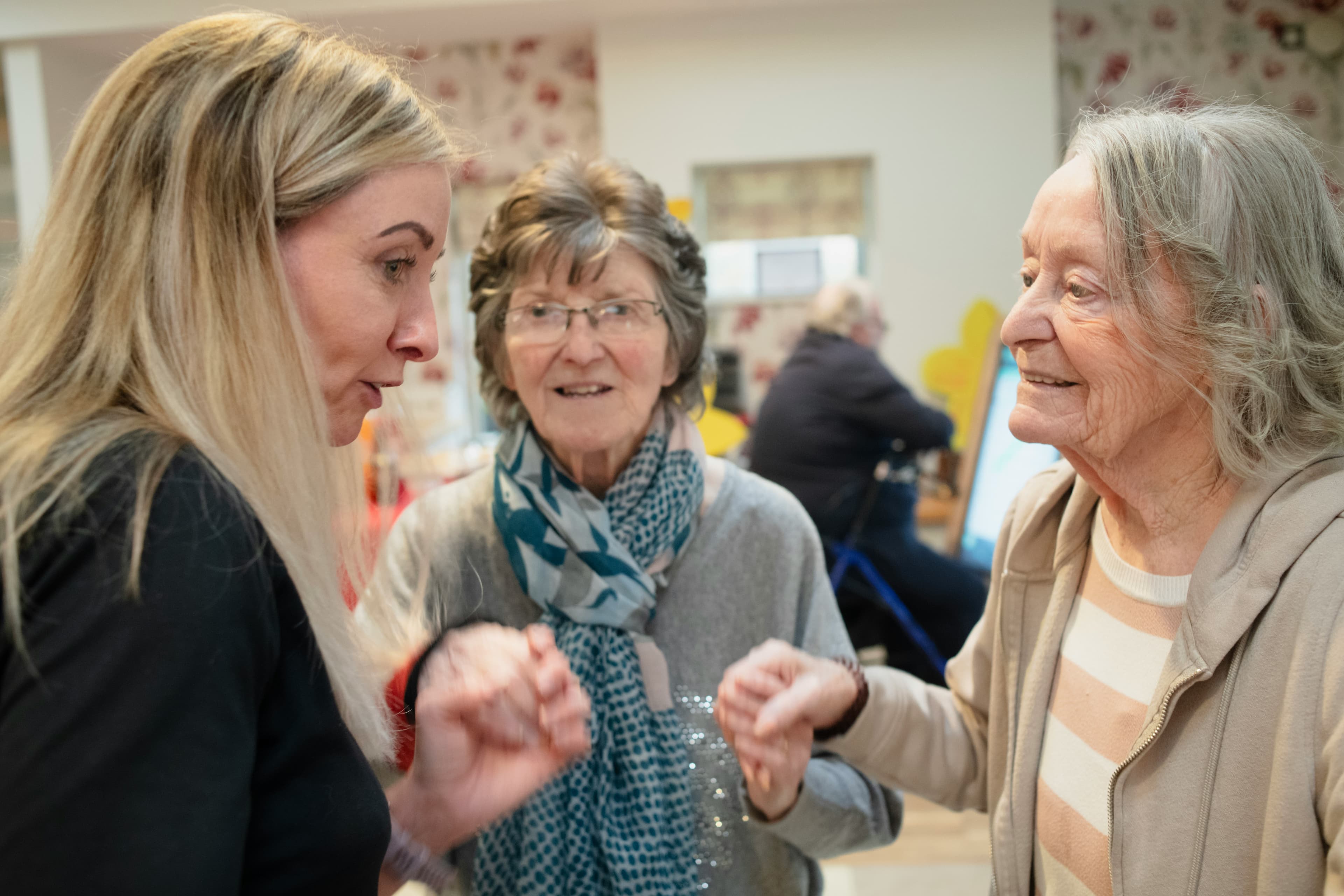 Caregiver sharing a warm moment of companionship with an elderly person