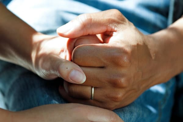 Caregiver providing compassionate support to elderly person with dementia